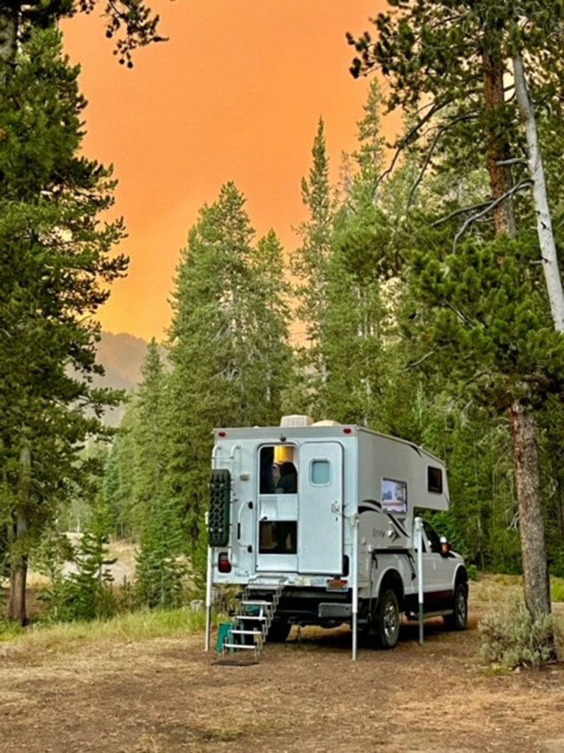 Northstar camper in the trees at sunset