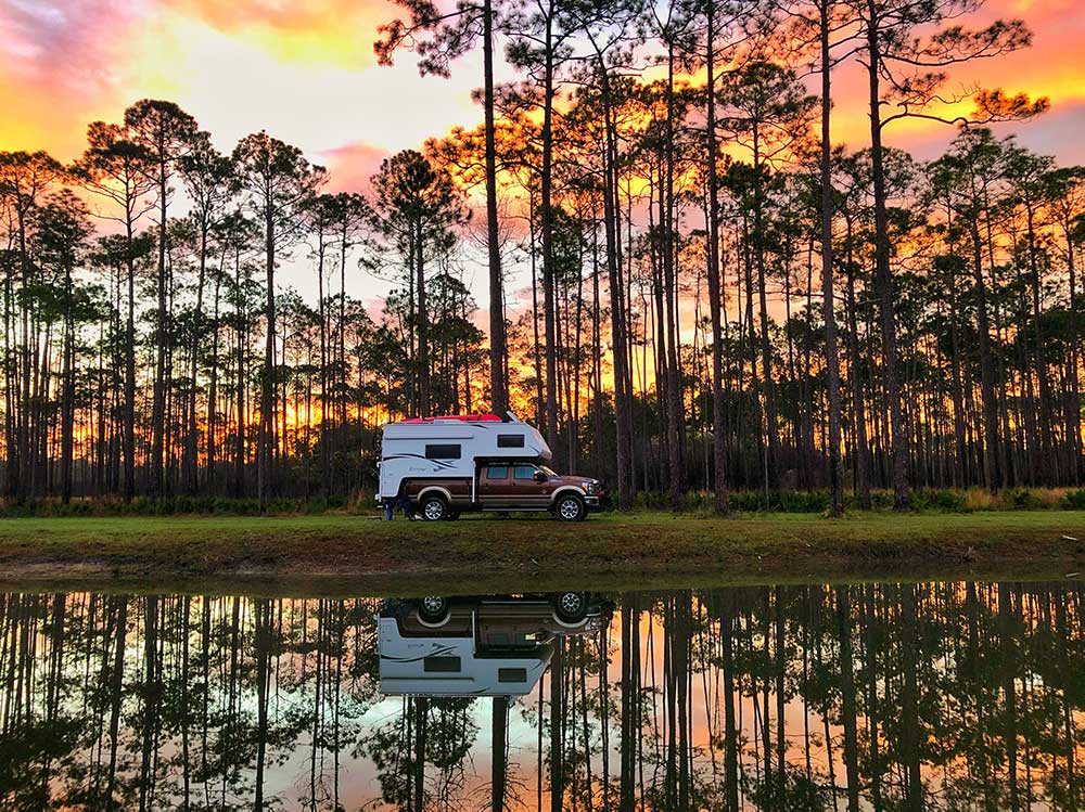 Northstar camper with sunset in the background